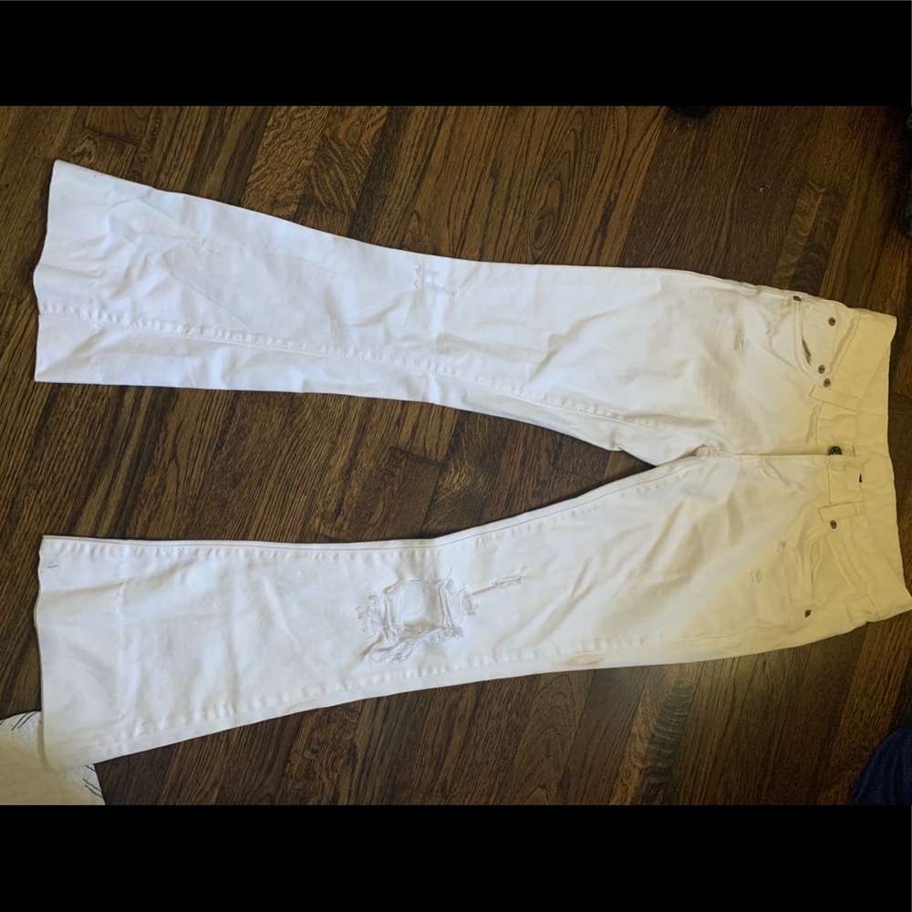 White bell bottom Carmar jeans